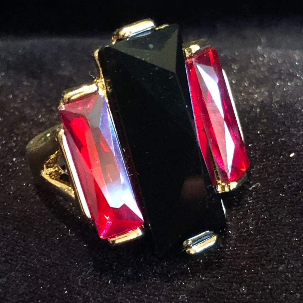 Black, red and gold ring